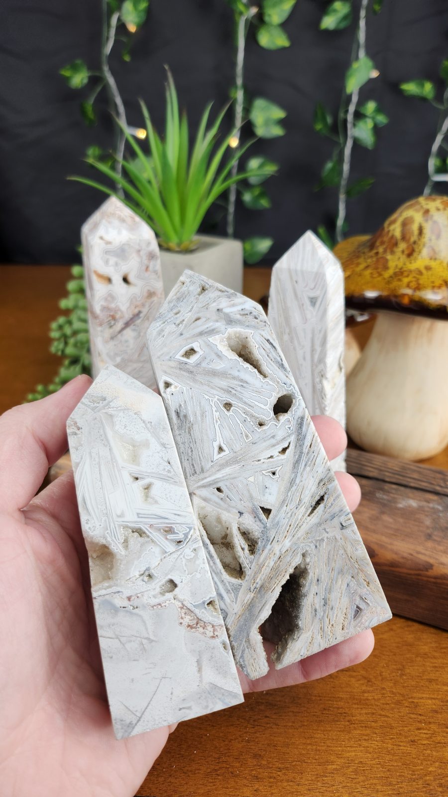 White Lace Agate Large Crystal Towers shown in hand for scale.