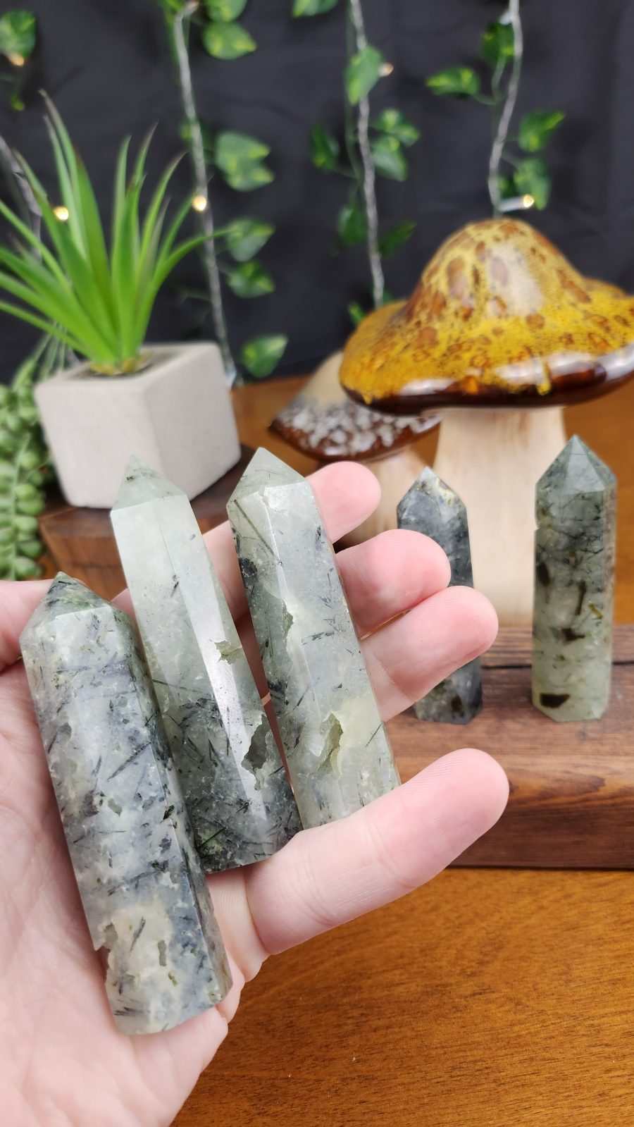 Prehnite Crystal Points shown in hand for scale.